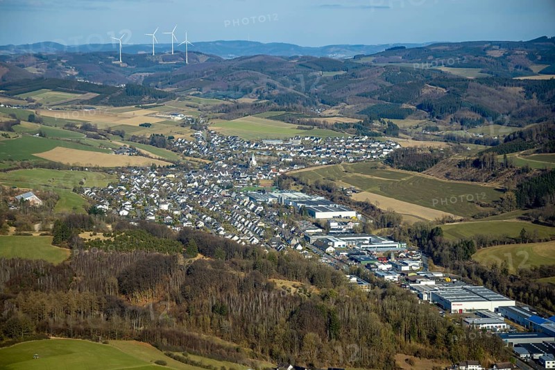 Aerial view, Elspe commercial area with residential area and village view with catholic church St. St James the Elder, forest and hilly landscape, Elspe, Lennestadt, Sauerland, North Rhine-Westphalia, Germany, place of worship, DE, Europe, commercial enterprises, commercial area, commercial property, commercial site, commercial use, religious community, place of worship, property tax, holy site, real estate, industrial site, church, parish, denomination, aerial view, aerial photography, aerial photography, religion, religious site, overview, bird's-eye view, residential area, residential area and living, residential quality, residential neighbourhood, residential estate, residential district, birds-eyes view, overview