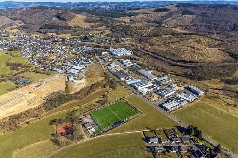 Aerial view, commercial area In der Welsmicke, football stadium sports ground SV Rahrbachtal 1989 e.V., Rahrbach, Kirchhundem, Sauerland, North Rhine-Westphalia, Germany, DE, Europe, football pitch, football stadium, commercial enterprises, commercial area, commercial property, commercial site, commercial use, industrial area, industrial site, aerial photograph, aerial photography, aerial photography, sports, sports facilities, sports ground, sports facility, stadium, overview, bird's-eye view, bird's-eye view, overview