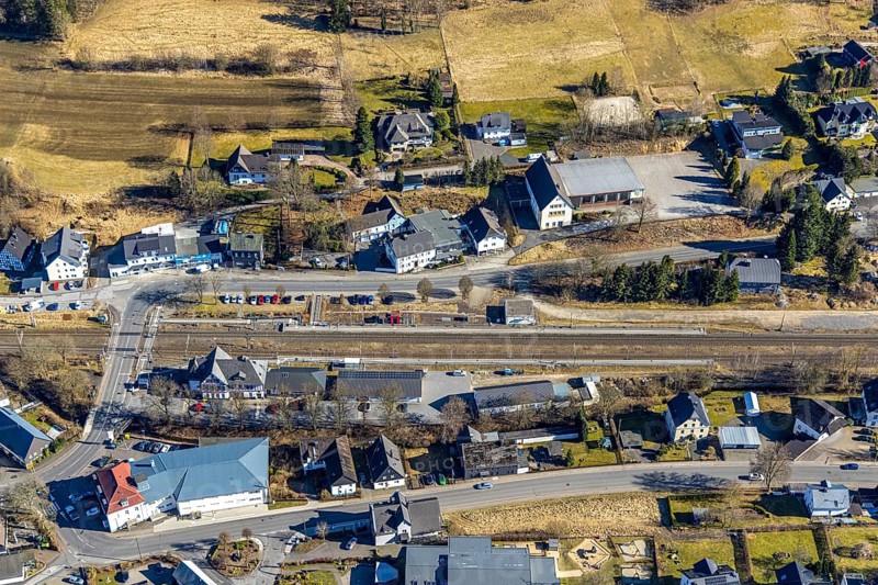 Aerial view, half-timbered station building Kirchhundem-Welschen Ennest railway station, tracks and level crossing, Welschen Ennest, Kirchhundem, Sauerland, North Rhine-Westphalia, Germany, DE, Europe, aerial view, aerial photography, aerial photography, overview, bird's-eye view, bird's-eye view, overview