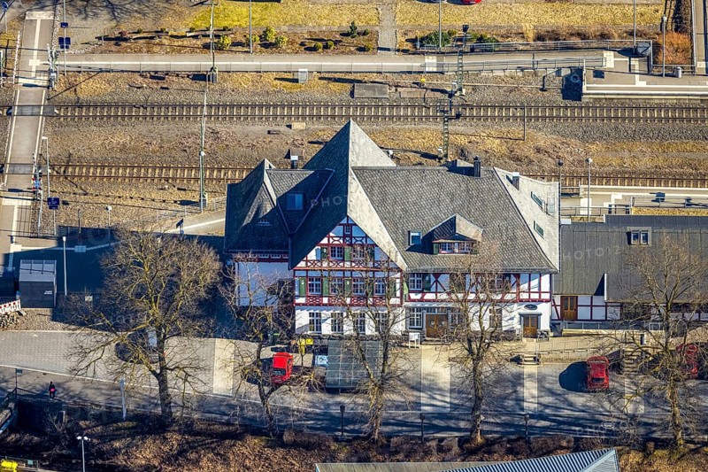 Aerial view, half-timbered station building Kirchhundem-Welschen Ennest railway station, tracks and level crossing, Welschen Ennest, Kirchhundem, Sauerland, North Rhine-Westphalia, Germany, DE, Europe, aerial view, aerial photography, aerial photography, overview, bird's-eye view, bird's-eye view, overview