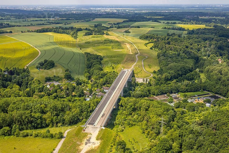 Aerial view, construction site Angerbachtalbrücke, new motorway construction section of the A44, gap closure between Ratingen-Ost and Velbert, sewage treatment plant Angertal, Heiligenhaus, Ruhr area, North Rhine-Westphalia, Germany, A44, Angerbachtalbrücke, Angertal, architecture, motorway, motorway bridge, construction work, construction area, construction site, building site, building plots, construction project, construction site, construction industry, bridge construction, DE, development, Europe, industry, infrastructure, infrastructure project, sewage treatment plant, landscape, aerial view, aerial photography, aerial photography, gap closure, new construction, new construction section, Ratingen-Ost, region, regional development, city view, road construction, technology, transport, overview, surroundings, Velbert, traffic, traffic routes, bird's-eye view, birds-eyes view, modern, overview