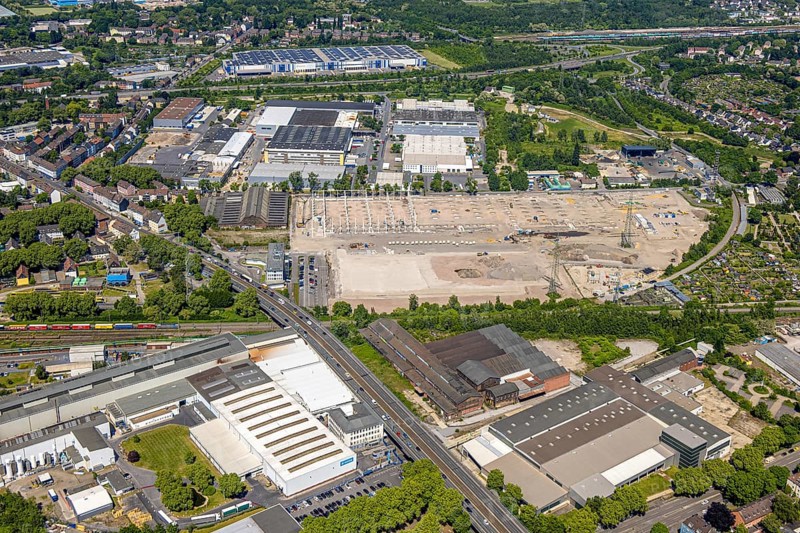 Aerial view, industrial park Gewerbegebiet Berliner Brücke and construction site with new building, behind Gewerbepark Schalke, Schalke, Gelsenkirchen, Ruhr area, North Rhine-Westphalia, Germany