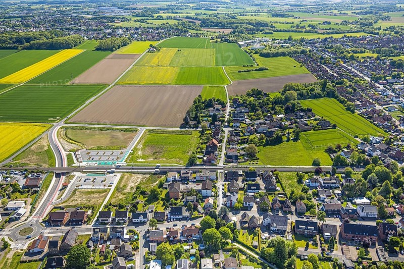 Aerial view, planned local transport connection with stop in Westtünnen, construction site at Südfeldweg and Von-Thünen-Straße for the future railway stop, railway line with railway bridge, car parks, Rhynern district, Hamm, Ruhr area, North Rhine-Westphalia, Germany