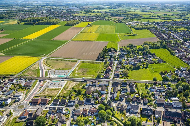 Aerial view, planned local transport connection with stop in Westtünnen, construction site at Südfeldweg and Von-Thünen-Straße for the future railway stop, railway line with railway bridge, car parks, Rhynern district, Hamm, Ruhr area, North Rhine-Westphalia, Germany