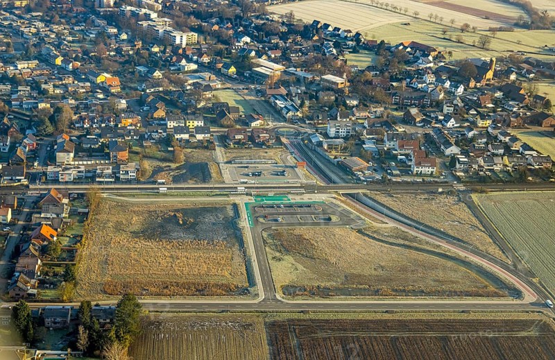 Aerial view, planned local transport connection with stop in Westtünnen, construction site on Südfeldweg and Von-Thünen-Straße for the future railway stop, railway line with railway bridge and housing estate with roundabout, car parks, Rhynern district, Hamm, Ruhr area, North Rhine-Westphalia, Germany