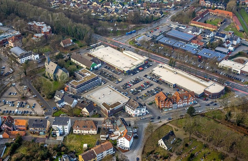 Aerial view, Dortmunder Straße shopping centre with DM, Aldi and Edeka supermarket, St. Victor's Lutheran Church, construction site with new building, Herringer Zentrum, Herringen district, Hamm, Ruhr area, North Rhine-Westphalia, Germany