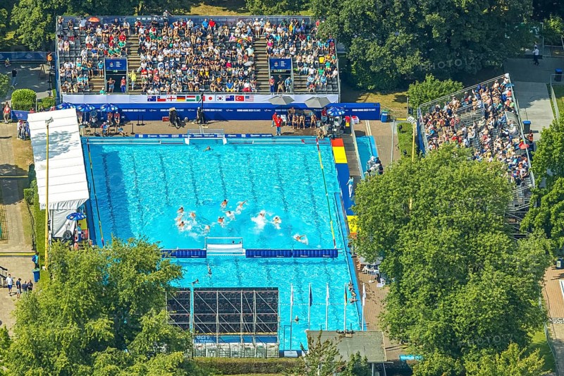 Aerial view, sports park with outdoor swimming pool swimming stadium ASC Dusiburg at Kruppstraße, water polo competition with spectators on stands, World Student Games FISU World University Games 2025, Rhine-Ruhr 2025, Neudorf, Duisburg, Ruhr area, North Rhine-Westphalia, Germany, bathing establishment, bathing resort, DE, Europe, outdoor swimming pool, aerial view, aerial photography, aerial photography, swimming pool, swimming pool, sports, overview, bird's eye view, birds-eyes view, overview