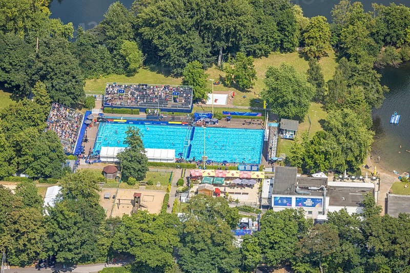 Aerial view, sports park with outdoor swimming pool swimming stadium ASC Dusiburg at Kruppstraße, water polo competition with spectators on stands, World Student Games FISU World University Games 2025, Rhine-Ruhr 2025, Neudorf, Duisburg, Ruhr area, North Rhine-Westphalia, Germany, bathing establishment, bathing resort, DE, Europe, outdoor swimming pool, aerial view, aerial photography, aerial photography, swimming pool, swimming pool, sports, overview, bird's eye view, birds-eyes view, overview