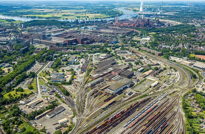 Aerial view, reserve parts centre Duisburg thyssenkrupp Steel Europe AG and goods station, rear thyssenkrupp Steel Europe AG plant, Marxloh, Duisburg, Ruhr area, North Rhine-Westphalia, Germany, railway area, DE, Europe, commercial enterprises, commercial area, commercial property, commercial site, commercial use, railway tracks, tracks, industrial area, industrial site, aerial view, aerial photography, aerial photography, aerial photography, overview, bird's-eye view, birds-eyes view, overview