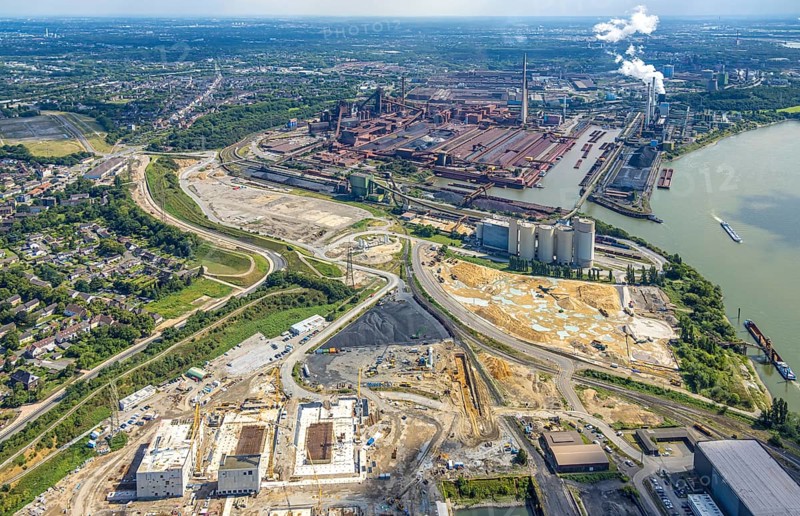 Aerial view, Schwelgern works harbour and thyssenkrupp Steel Europe AG and construction site on the river Rhine, Holcim Westcement concrete plant, construction site with new electrical switchgear buildings for direct reduction plant next to the south harbour Walsum, Marxloh, Duisburg, Ruhr area, North Rhine-Westphalia, Germany, construction work, construction area, construction site, building site, construction project, construction site, DE, Europe, aerial view, aerial photography, aerial photography, overview, bird's eye view, bird's eye view, overview