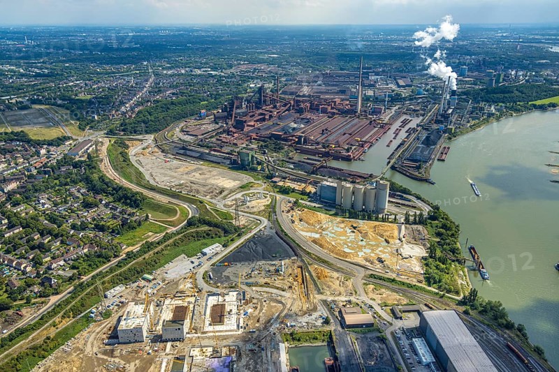 Aerial view, Schwelgern works harbour and thyssenkrupp Steel Europe AG and construction site on the river Rhine, Holcim Westcement concrete plant, construction site with new electrical switchgear buildings for direct reduction plant next to the south harbour Walsum, Marxloh, Duisburg, Ruhr area, North Rhine-Westphalia, Germany, construction work, construction area, construction site, building site, construction project, construction site, DE, Europe, aerial view, aerial photography, aerial photography, overview, bird's eye view, bird's eye view, overview