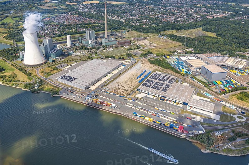 Aerial view, logport VI (six) Walsum, industrial estate and construction site with new building at the STEAG Walsum power station on the Rhine, steaming cooling tower, Alt-Walsum, Duisburg, Ruhr area, North Rhine-Westphalia, Germany, construction work, construction area, construction site, building land, construction project, construction site, DE, Duisburg-Nord, Europe, commercial enterprises, commercial area, commercial area, commercial property, business park, commercial location, commercial use, large construction site, freight transport, combined heat and power plant, industrial area, industrial location, power plant, logistics, logistics service, logistics service provider, logistics provider, logistics centre, aerial view, aerial photography, aerial photography, new construction, transport service, overview, bird's eye view, birds-eyes view, logport 6 (Six), logport VI Walsum, multimodal logistics centre, overview