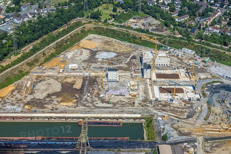 Aerial view, construction site with new construction of electrical switching houses for direct reduction plant next to the south harbour Walsum, Fahrn, Duisburg, Ruhr area, North Rhine-Westphalia, Germany, construction work, construction area, construction site, building plots, construction project, construction site, DE, DR plant, Europe, large construction site, aerial photograph, aerial photography, aerial photography, new construction, overview, bird's-eye view, bird's-eye view, overview