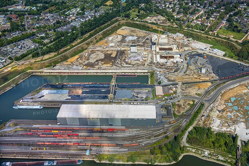Aerial view, construction site with new construction of electrical switching houses for direct reduction plant next to the south harbour Walsum, Fahrn, Duisburg, Ruhr area, North Rhine-Westphalia, Germany, construction work, construction area, construction site, building plots, construction project, construction site, DE, DR plant, Europe, large construction site, aerial photograph, aerial photography, aerial photography, new construction, overview, bird's-eye view, bird's-eye view, overview