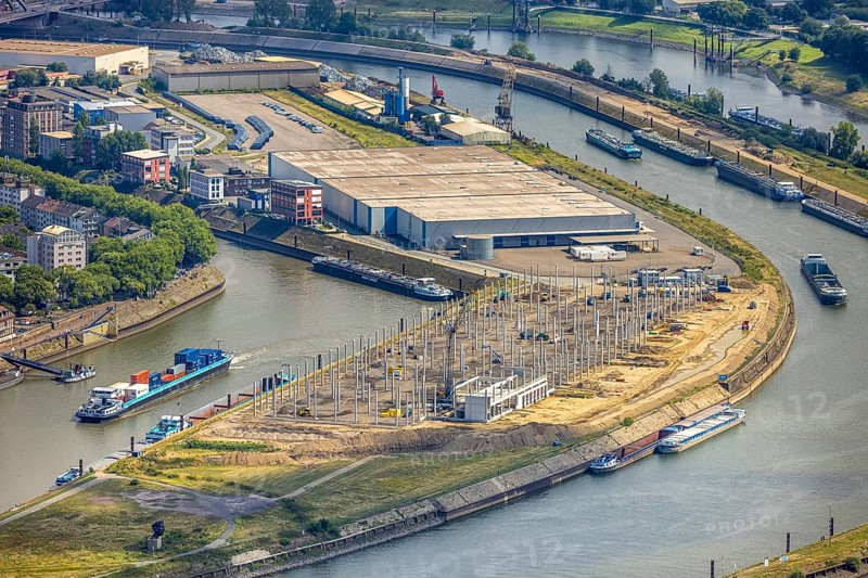Aerial view, Mercatorinsel inland navigation on Vinckekanal and harbour canal, Stangenwald construction site with new logistics hall, Ruhrort, Duisburg, Ruhr area, North Rhine-Westphalia, Germany, construction work, construction area, building site, building plots, construction project, construction site, DE, Europe, harbour, aerial view, aerial photography, aerial photography, Mercator Island, new construction, overview, bird's-eye view, overview