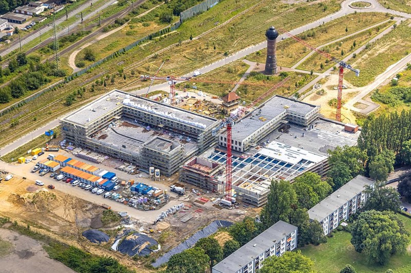 Aerial view, construction site with new building at the former Wedau marshalling yard for a new Duisburg residential quarter on the Sechs-Seen-Platte, water tower, Wedau, Duisburg, Ruhr area, North Rhine-Westphalia, Germany