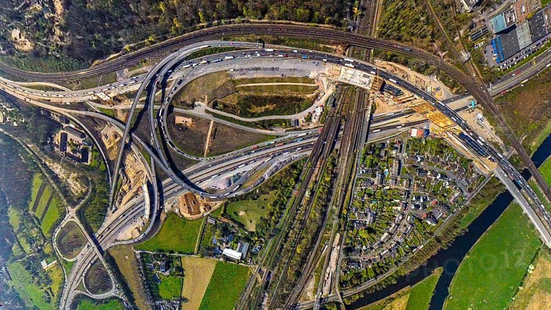 Aerial view, motorway junction Kaiserberg with motorway A3 and motorway A40, bridge construction and construction site rainwater retention basin, earth globe, fisheye image, 360 degree image, tiny world, little planet, fisheye image, Duissern, Duisburg, Ruhr area, North Rhine-Westphalia, Germany