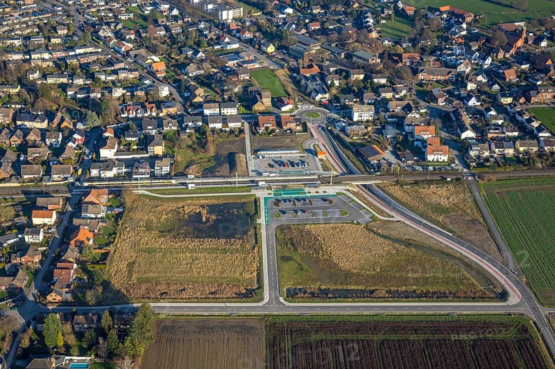 Aerial view, planned local transport connection with stop in Westtünnen, construction site at Südfeldweg and Von-Thünen-Straße for the future railway stop, railway line with railway bridge and housing estate with roundabout, Rhynern district, Hamm, Ruhr area, North Rhine-Westphalia, Germany