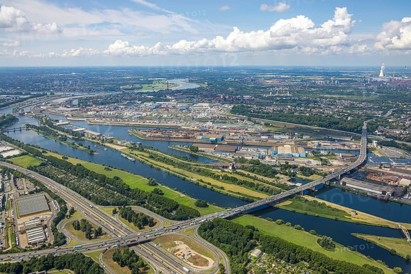 Aerial view, Berlin bridge of motorway A59 over river Ruhr and Rhine-Herne-Canal between motorway junction Dusiburg and harbour Duisburg, distant view and blue sky with clouds, Duissern, Duisburg, Ruhr area, North Rhine-Westphalia, Germany