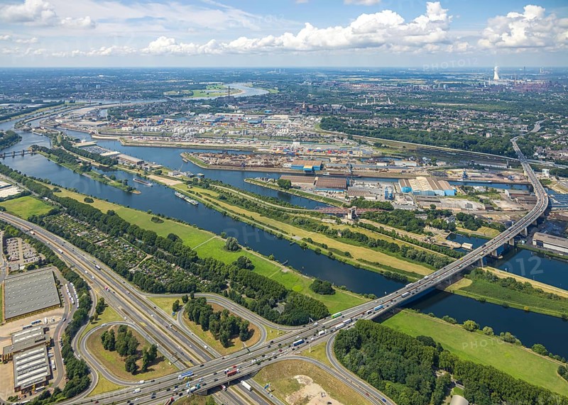 Aerial view, Berlin bridge of motorway A59 over river Ruhr and Rhine-Herne-Canal between motorway junction Dusiburg and harbour Duisburg, distant view and blue sky with clouds, Duissern, Duisburg, Ruhr area, North Rhine-Westphalia, Germany