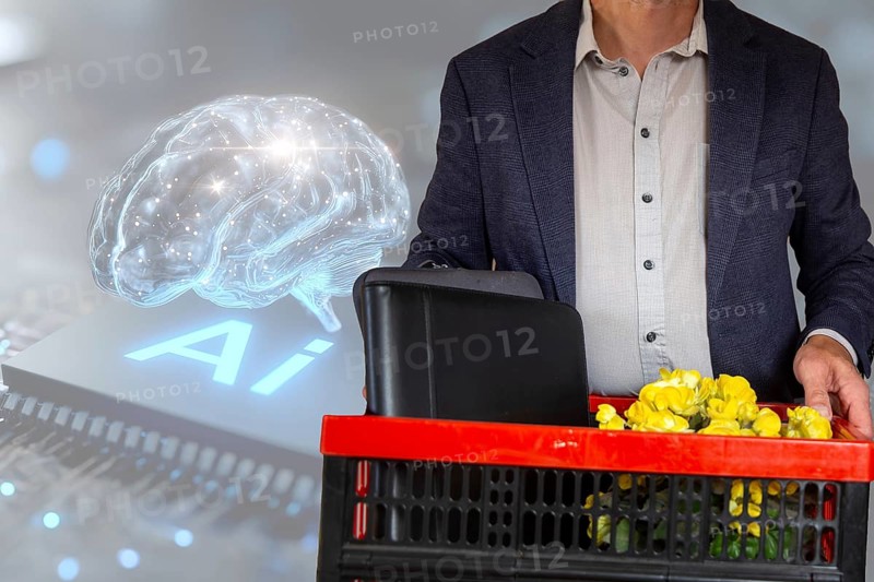 (Photomontage) Symbolic image of dismissal due to artificial intelligence: close-up of a dismissed employee in front of a virtual background