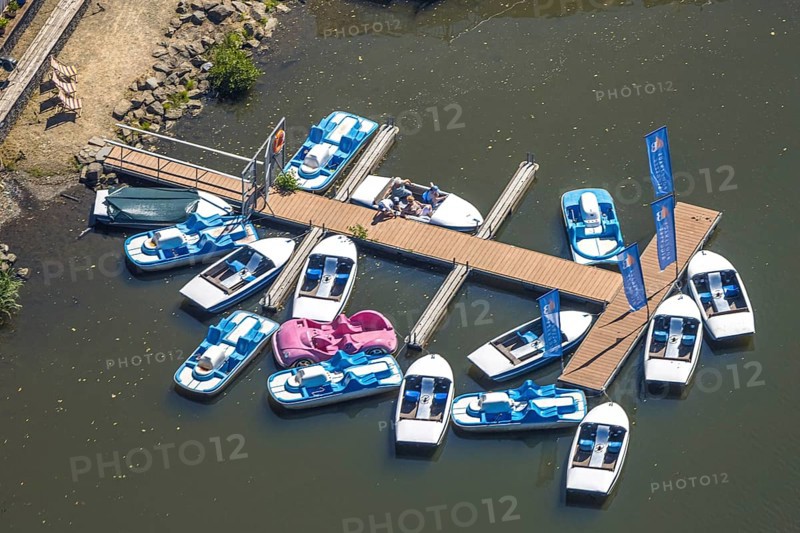 Aerial view, pedal boats at the landing stage at the Biggesee boathouse, people in the boat, shapes and colours, Olpe town, Olpe, Sauerland, North Rhine-Westphalia, Germany