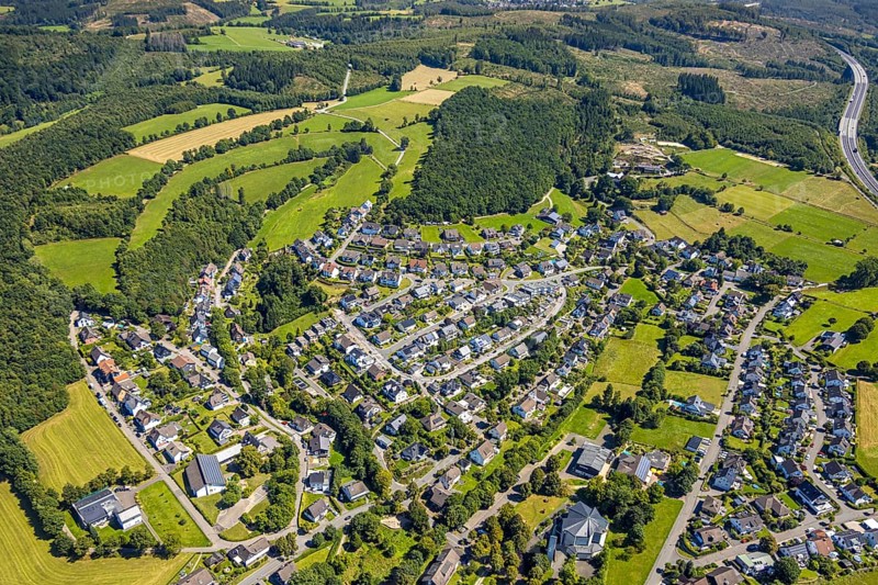 Aerial view, residential area, view of the district of Dahl, below St. Mary's Church and village community hall Dahl-Friedrichsthal, kindergarten Spatzennest, motorway A4 and forest with forest damage, Dahl, Olpe, Sauerland, North Rhine-Westphalia, Germany
