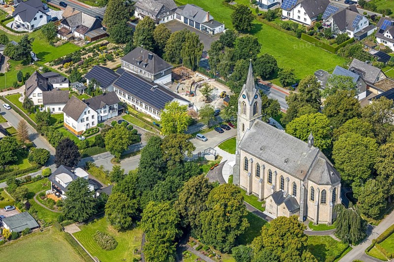 Aerial view, St. Pankratius cath. Church, Raphaelschule Eslohe - Reiste sub-location with solar roof, construction site, Reiste, Eslohe, Sauerland, North Rhine-Westphalia, Germany, place of worship, construction work, construction area, building site, building plots, construction project, education, educational institution, DE, roof with solar panels, Europe, religious community, place of worship, sacred site, church, parish, denomination, educational institute, aerial view, aerial photography, aerial photography, Meschede, photovoltaic system, religion, religious site, Ruhr area, school, solar, solar system, solar roof, solar energy, solar panels, solar power system, overview, bird's-eye view, overview