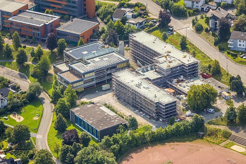 Aerial view, August-Macke-Schulzentrum, St. Walburga catholic secondary school and St. Walburga Realschule Meschede with solar roof, construction site with scaffolding, Meschede town, Meschede, Sauerland, North Rhine-Westphalia, Germany, construction work, construction area, building site, building plots, construction project, construction site, education, educational institution, DE, Europe, secondary school, teaching institute, aerial photograph, aerial photography, aerial photography, new building, secondary school, Ruhr area, school, overview, bird's eye view, birds-eyes view, overview
