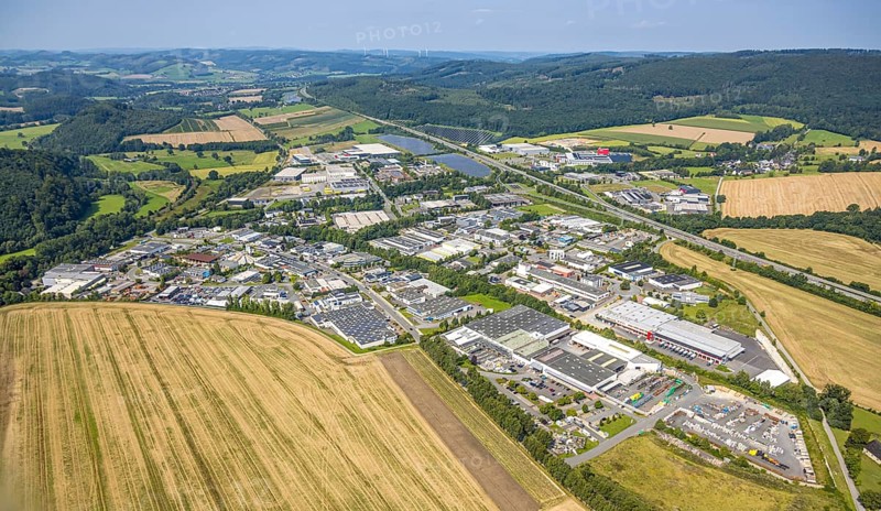 Aerial view, general view of the Enste industrial estate, citizen solar park photovoltaic solar power plant on the A46 motorway and forest, Enste, Meschede, Sauerland, North Rhine-Westphalia, Germany, DE, Europe, commercial enterprise, commercial space, commercial area, commercial property, industrial park, commercial location, commercial use, industrial area, industrial location, aerial view, aerial photography, aerial photography, photovoltaic plant, Ruhr area, solar, solar plant, solar energy, solar park, solar power plant, overview, bird's-eye view, birds-eyes view, overview