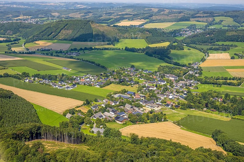 Aerial view, residential area local view district Altenhellefeld, meadows and fields in hilly landscape, behind mountain and Hardt forest area with forest damage, Altenhellefeld, Sundern, Sauerland, North Rhine-Westphalia, Germany, tree mortality, DE, Europe, property tax, real estate, clear cutting, calamity areas, aerial view, aerial photography, aerial photography, Meschede, Ruhr area, overview, bird's-eye view, forest, forest damage, forest dieback, residential area, housing and living, residential area, residential quality, residential neighbourhood, housing estate, residential area, birds-eyes view, overview