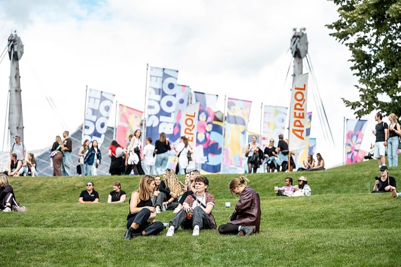 Visitors relaxing in a meadow at the Superbloom Festival, Day 1 in the Olympic Park, Munich, 30/08/2025