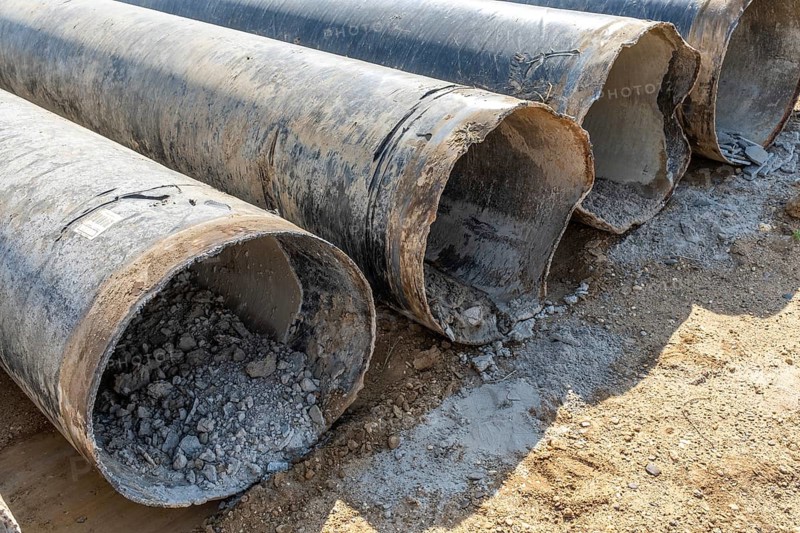 Old pipes with concrete residue in an open-cast mine, Manheim, North Rhine-Westphalia, Germany