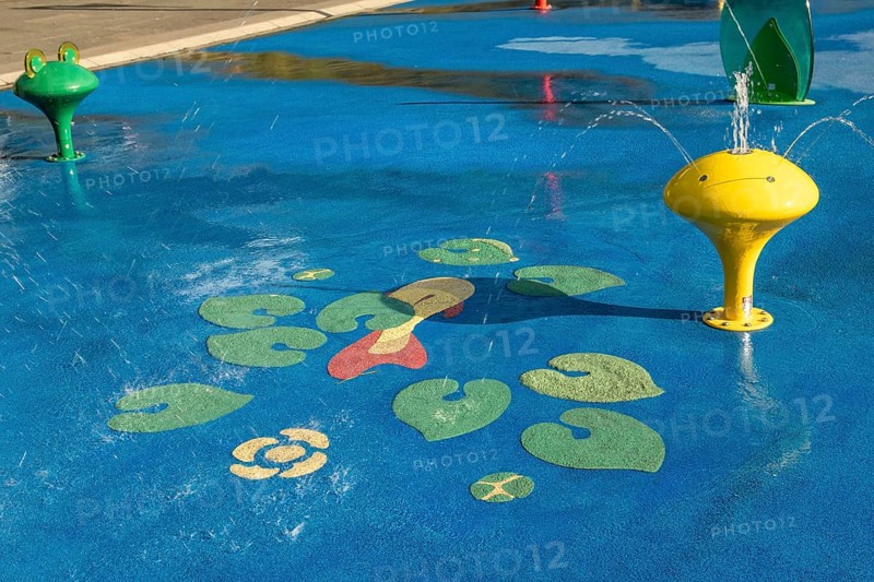 Yellow water play equipment with water lily motif