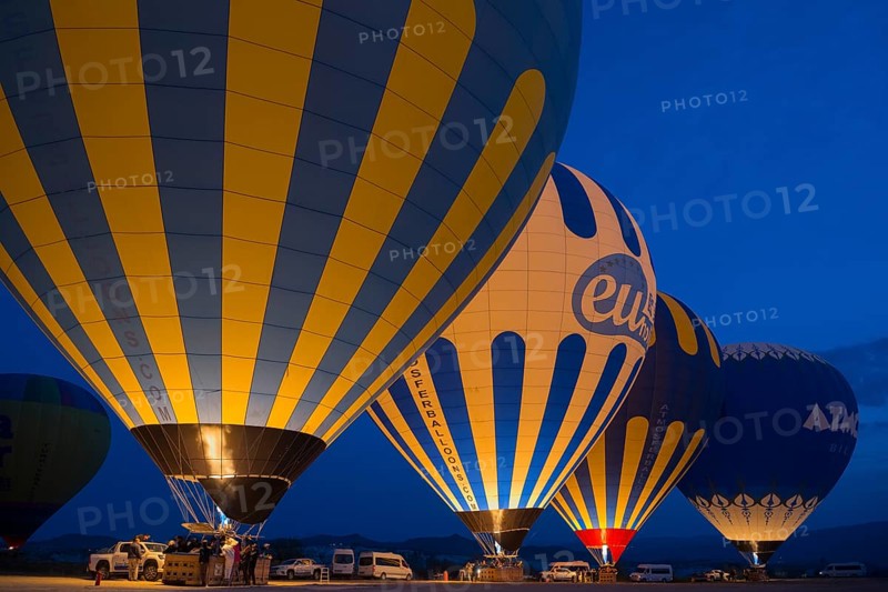 Hot air balloons glow in the dark with colourful lights, Göreme National Park, Göreme Tarihî Millî Parki, Nevsehir Province, Nevsehir, Cappadocia, Cappadocia, Cappadocia, Cappadocia, Central Anatolia, Turkey