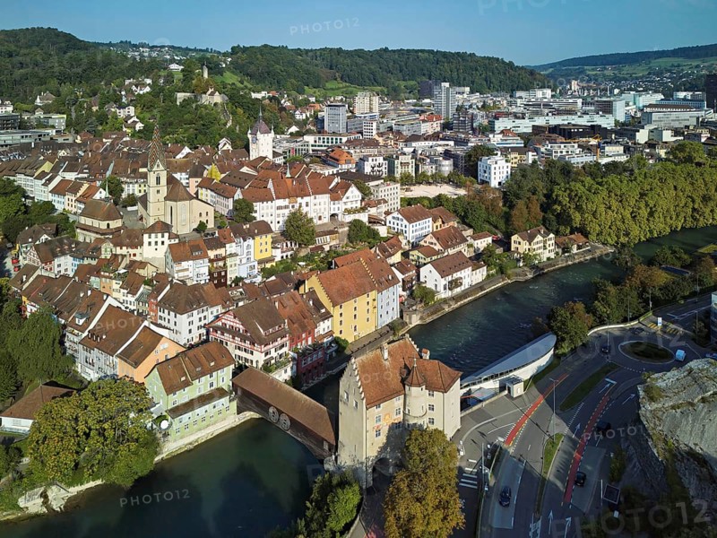 View of the old town with the parish church of Maria Himmelfahrt, in the background the ruins of Stein Castle, formerly an administrative centre of the Habsburgs, on the right the river Limmat and the covered wooden bridge with the Landvogteischloss, Baden, Canton, Aargau, Switzerland
