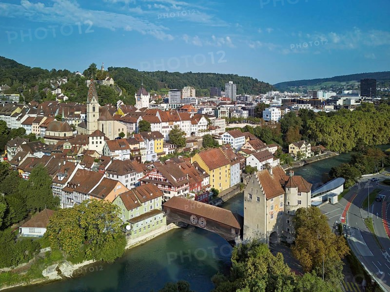 View of the old town with the parish church of Maria Himmelfahrt, in the background the ruins of Stein Castle, formerly an administrative centre of the Habsburgs, on the right the river Limmat and the covered wooden bridge with the Landvogteischloss, Baden, Canton, Aargau, Switzerland
