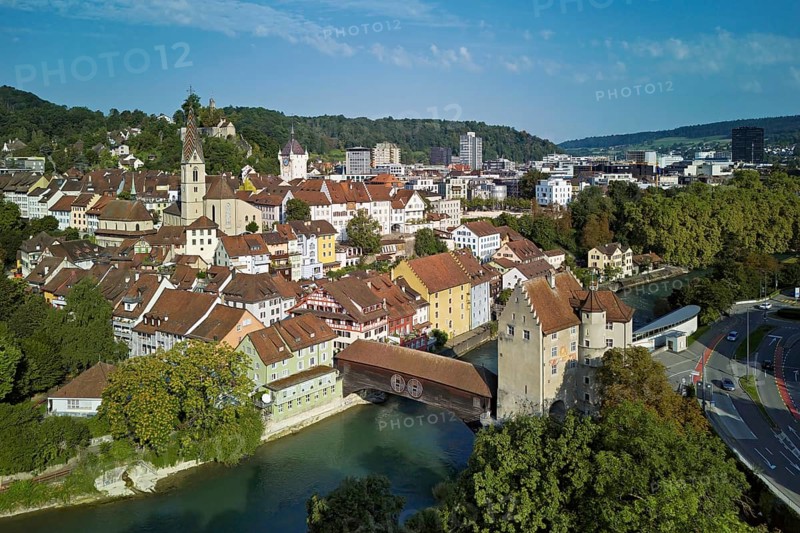 View of the old town with the parish church of Maria Himmelfahrt, in the background the ruins of Stein Castle, formerly an administrative centre of the Habsburgs, on the right the river Limmat and the covered wooden bridge with the Landvogteischloss, Baden, Canton, Aargau, Switzerland