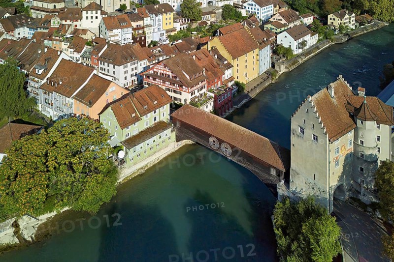 View of the old town, on the right the river Limmat and the covered wooden bridge with the Landvogteischloss, Baden, Canton, Aargau, Switzerland