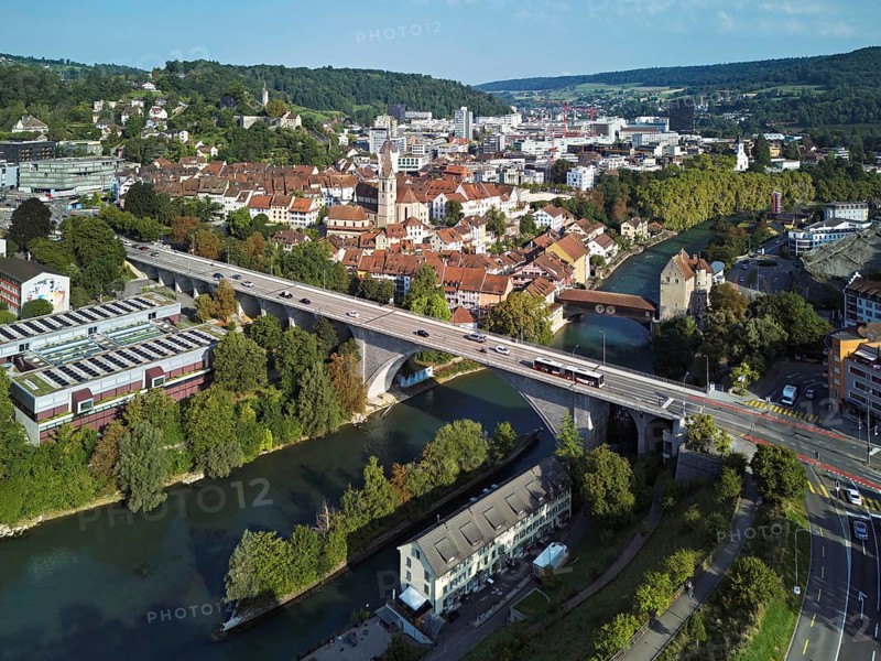 View of the town with the high bridge in front, the old town and the covered wooden bridge with the Landvogteischloss on the river Limmat behind, Baden, Canton, Aargau, Switzerland
