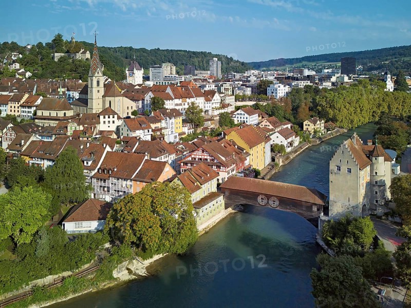 View of the old town with the parish church of Maria Himmelfahrt, in the background the ruins of Stein Castle, formerly an administrative centre of the Habsburgs, on the right the river Limmat and the covered wooden bridge with the Landvogteischloss, Baden, Canton Aargau, Switzerland