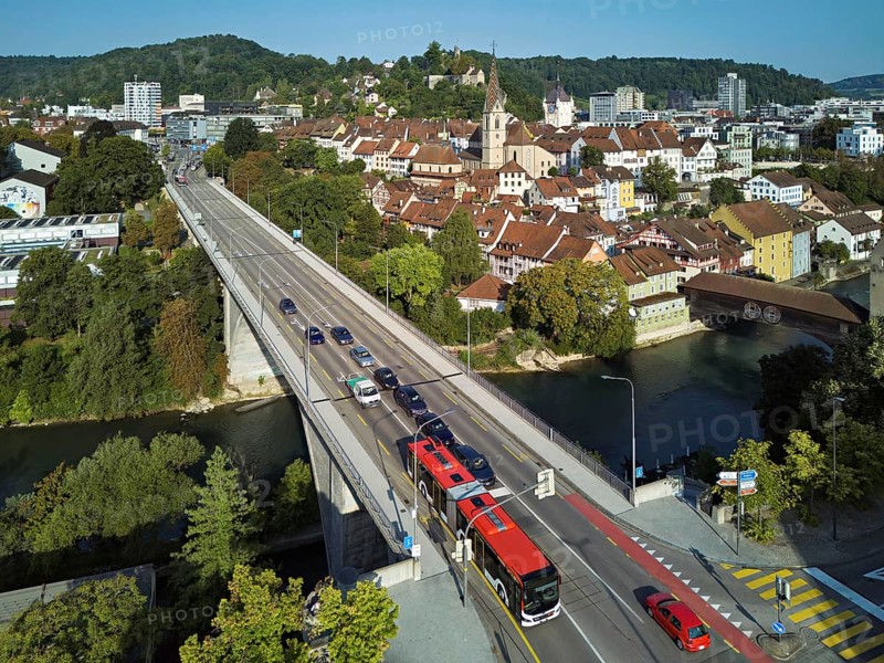 View of the old town with the parish church of Maria Himmelfahrt, in the foreground the high bridge, in the background the ruins of Stein Castle formerly an administrative centre of the Habsburgs, on the right the river Limmat and the covered wooden bridge, Baden, Canton, Aargau, Switzerland