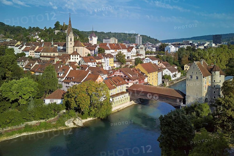 View of the old town with the parish church of Maria Himmelfahrt, in the background the ruins of Stein Castle, formerly an administrative centre of the Habsburgs, on the right the river Limmat and the covered wooden bridge with the Landvogteischloss, Baden, Canton, Aargau, Switzerland