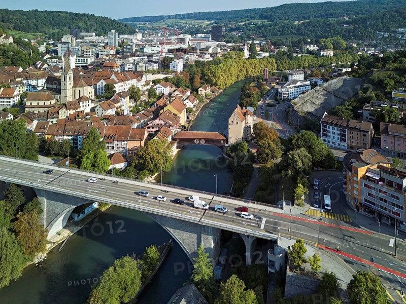 View of the town with the high bridge in front, the old town and the covered wooden bridge with the Landvogteischloss on the river Limmat behind, Baden, Canton, Aargau, Switzerland