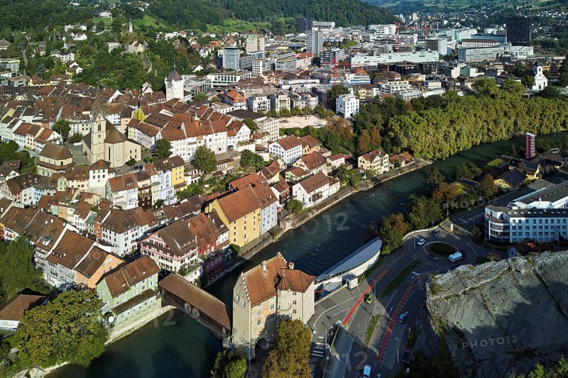 View of the old town with the parish church of Maria Himmelfahrt, in the background the ruins of Stein Castle, formerly an administrative centre of the Habsburgs, on the right the river Limmat and the covered wooden bridge with the Landvogteischloss, Baden, Canton, Aargau, Switzerland
