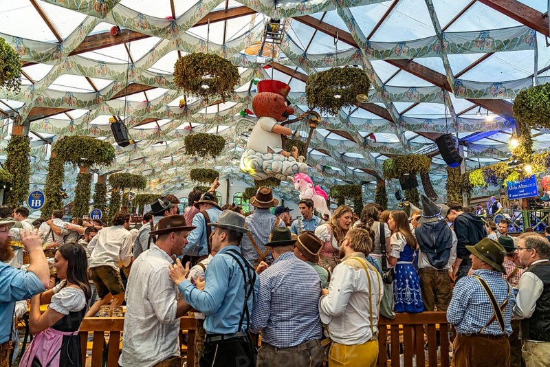 Visitors in the Hofbräu marquee at the Oktoberfest 2024 in Munich, Bavaria, Germany