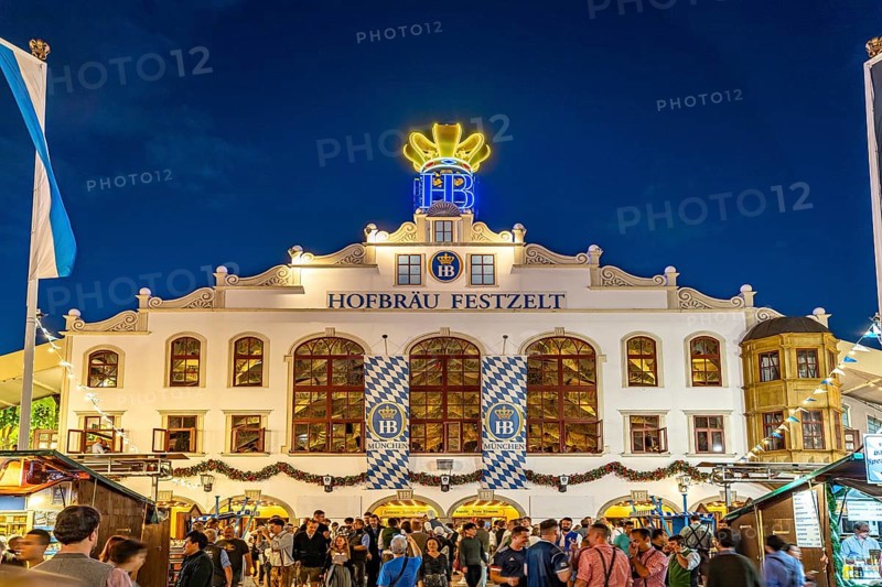 The Hofbräu marquee at Oktoberfest 2024 at dusk, Munich, Bavaria, Germany