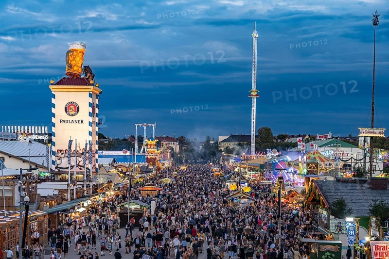 Visitors at the Oktoberfest 2024 seen from above at dusk, Munich, Bavaria, Germany