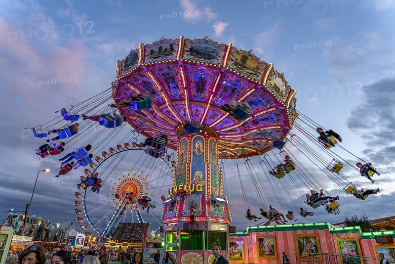 Chain carousel at Oktoberfest 2024 at dusk, Munich, Bavaria, Germany
