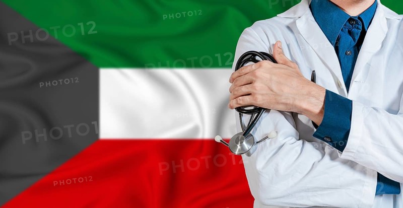 Doctor with stethoscope on Kuwait flag. Doctor holding stethoscope on Kuwait flag